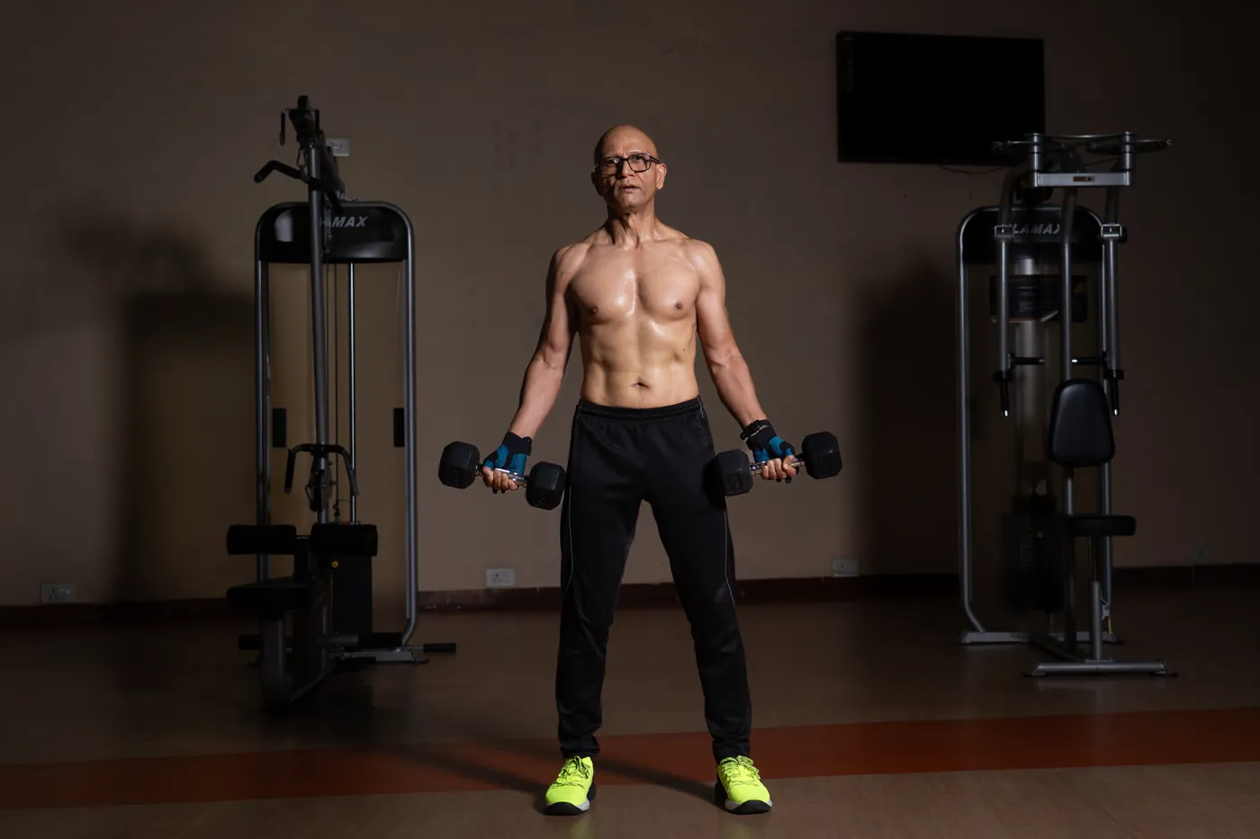 Ajay performing dumbbell curls