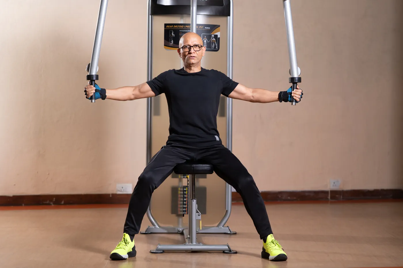 Ajay training on a chest fly machine